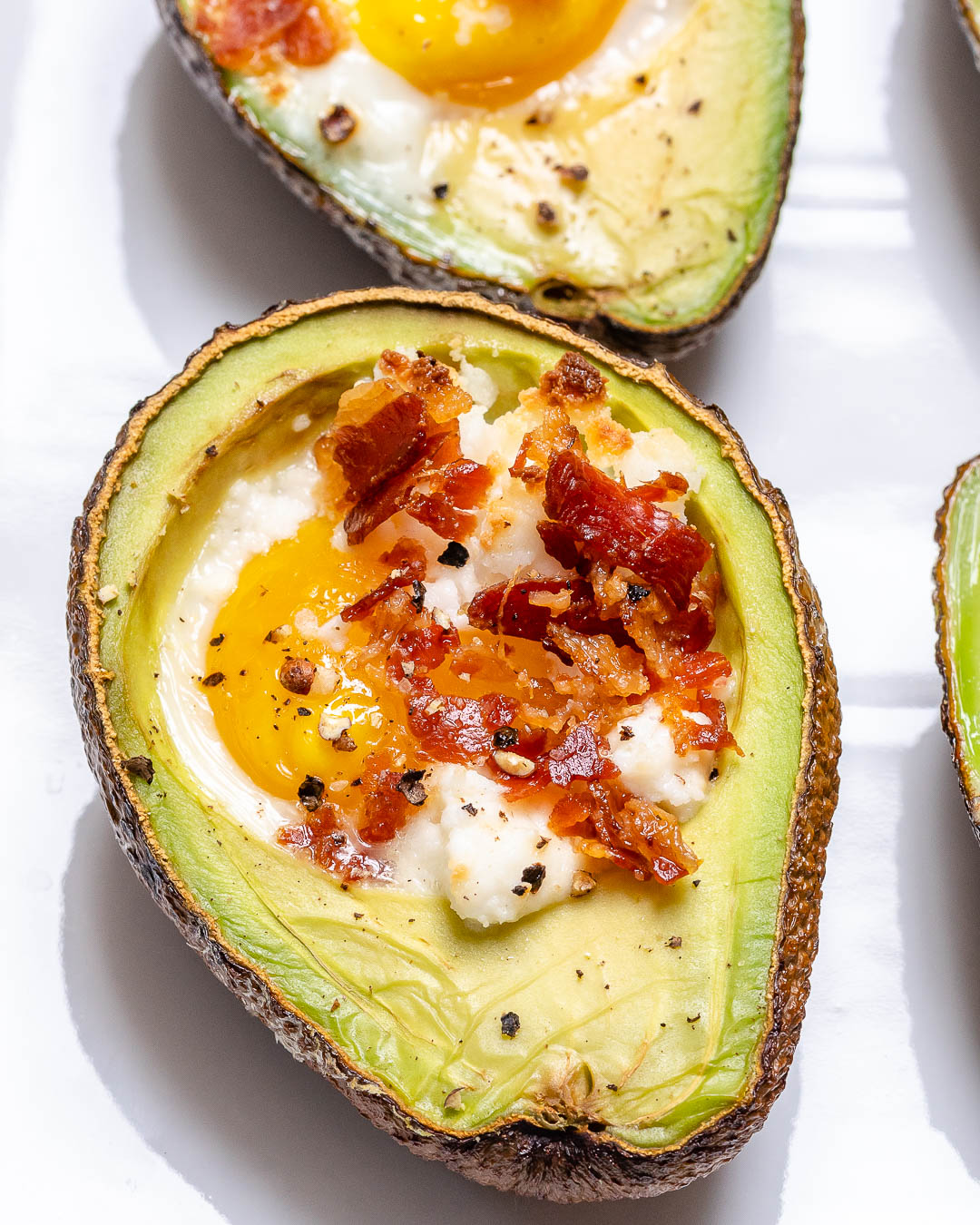 Baked Avocado Egg Cups with Pan-Fried Bacon