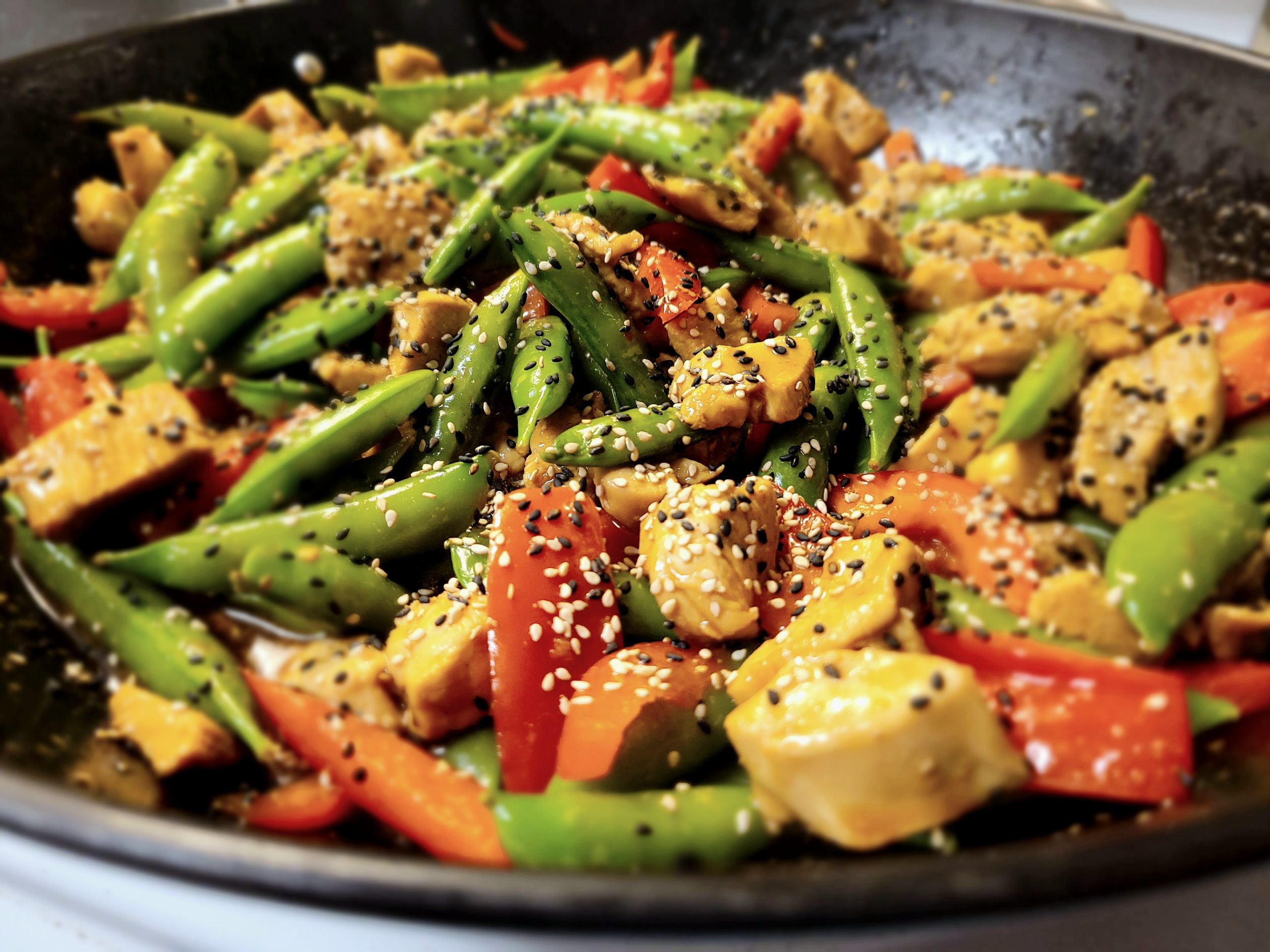 Ginger-Glazed Chicken Stir-Fry with Bell Peppers and Snap Peas