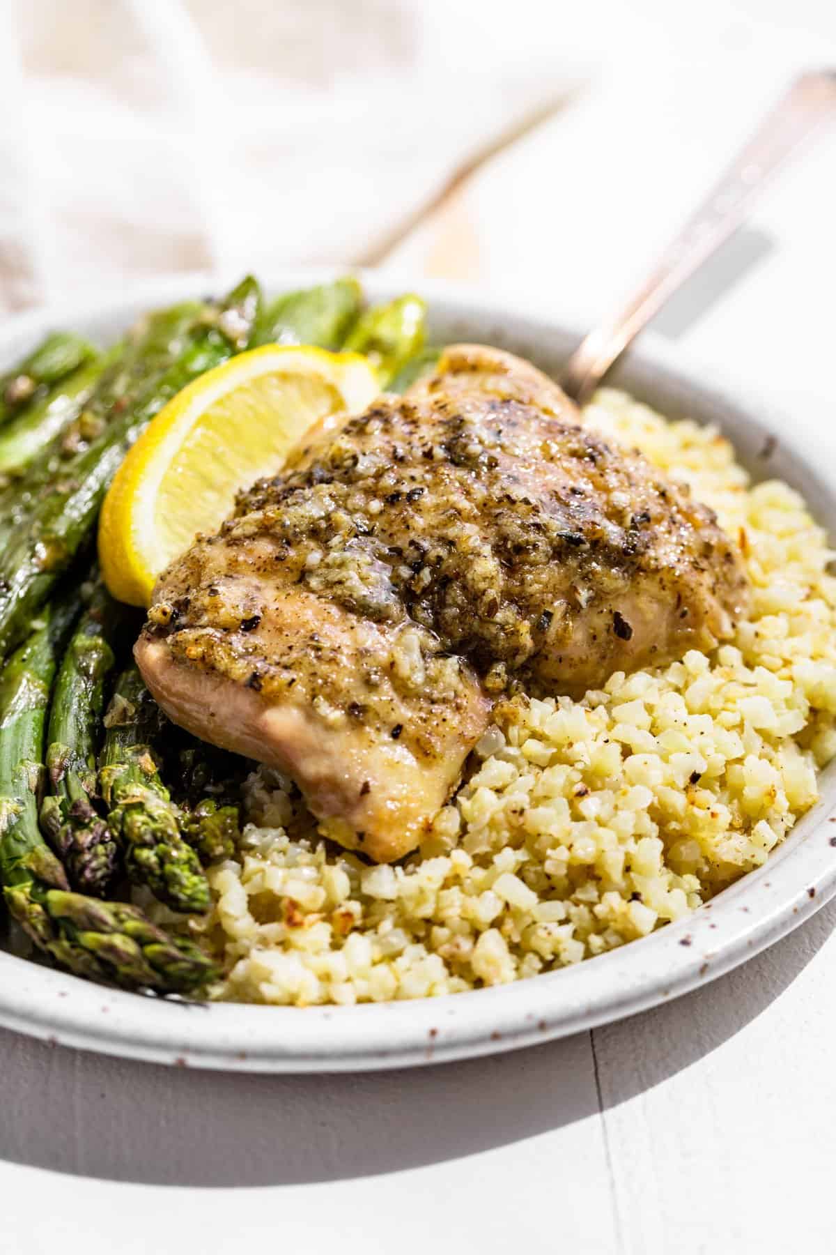 Oven-Baked Garlic Herb Chicken Thighs with Asparagus