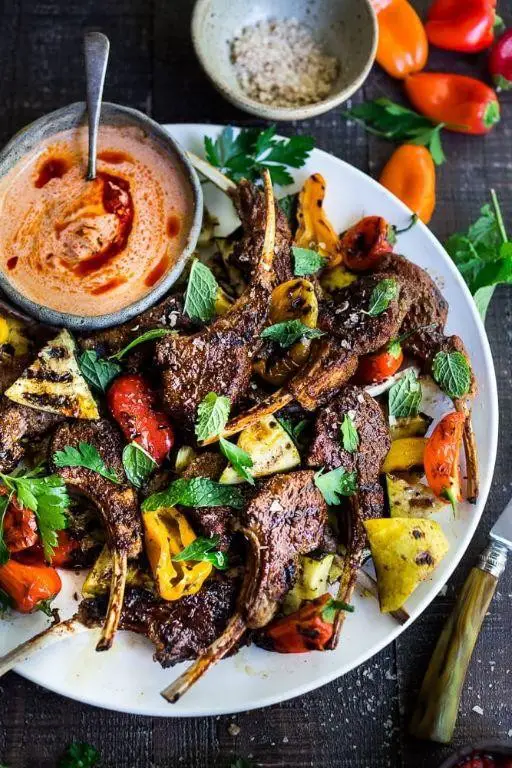 Harissa-Rubbed Lamb Chops with Roasted Cherry Tomatoes