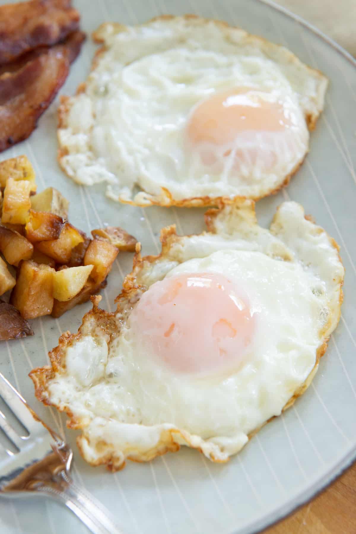 Crisp-Fried Bacon with Runny Yolk Eggs