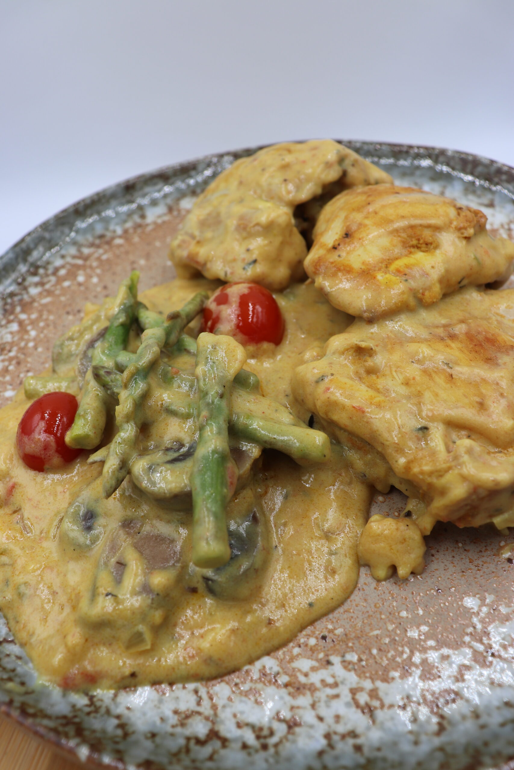 Herb-Roasted Chicken with Asparagus and Cherry Tomatoes