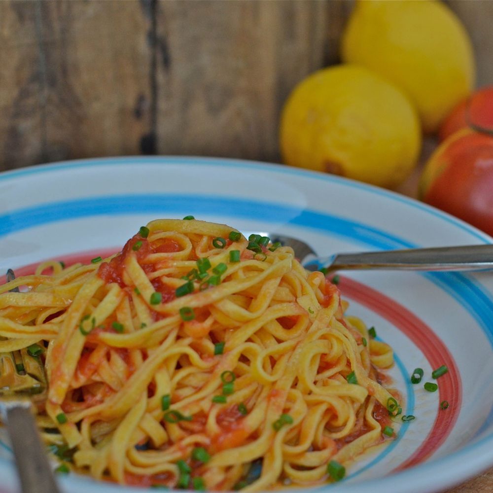 Saffron-Infused Tomato Pasta with Lemon Zest