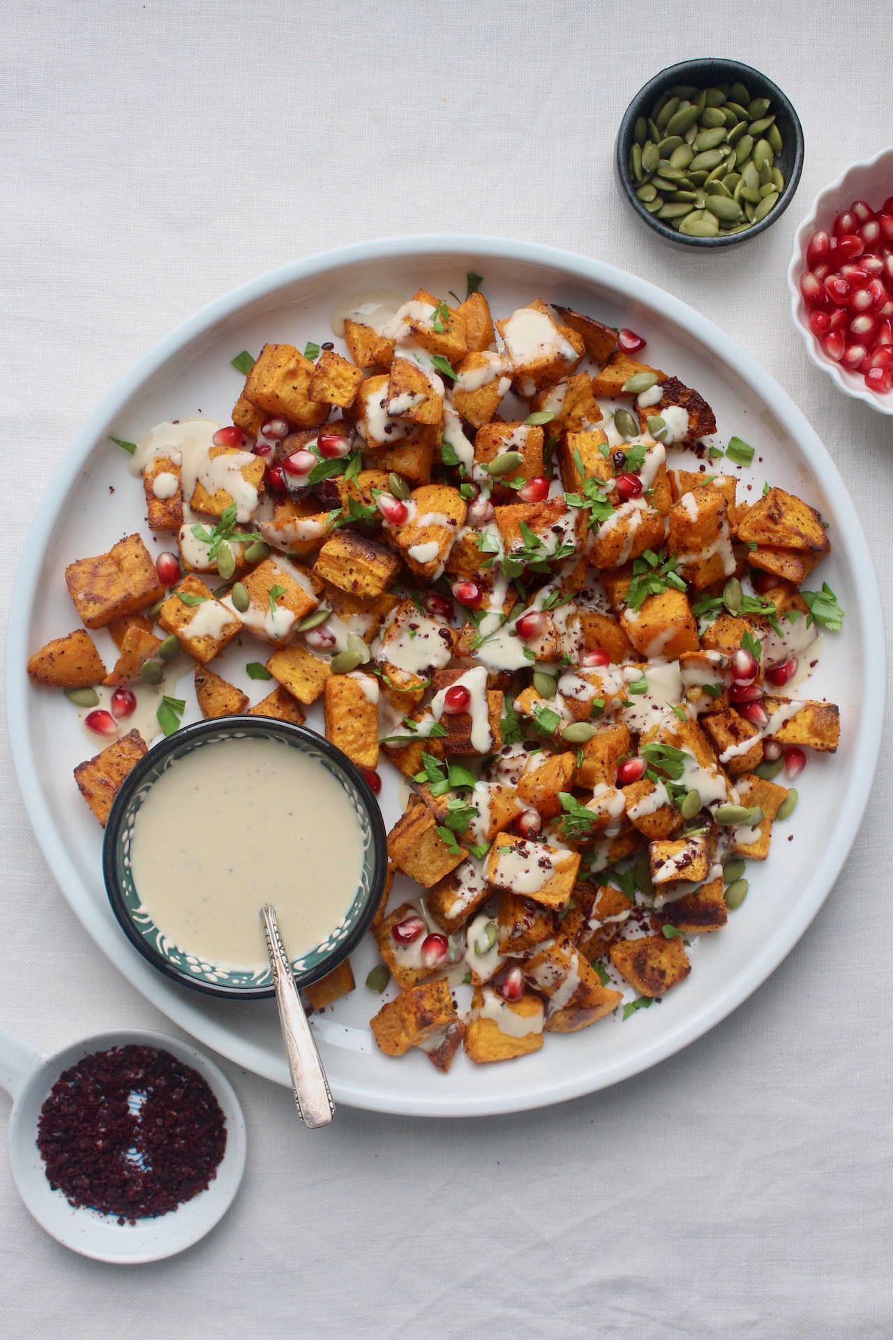 Harissa-Spiced Roasted Sweet Potatoes with Tahini