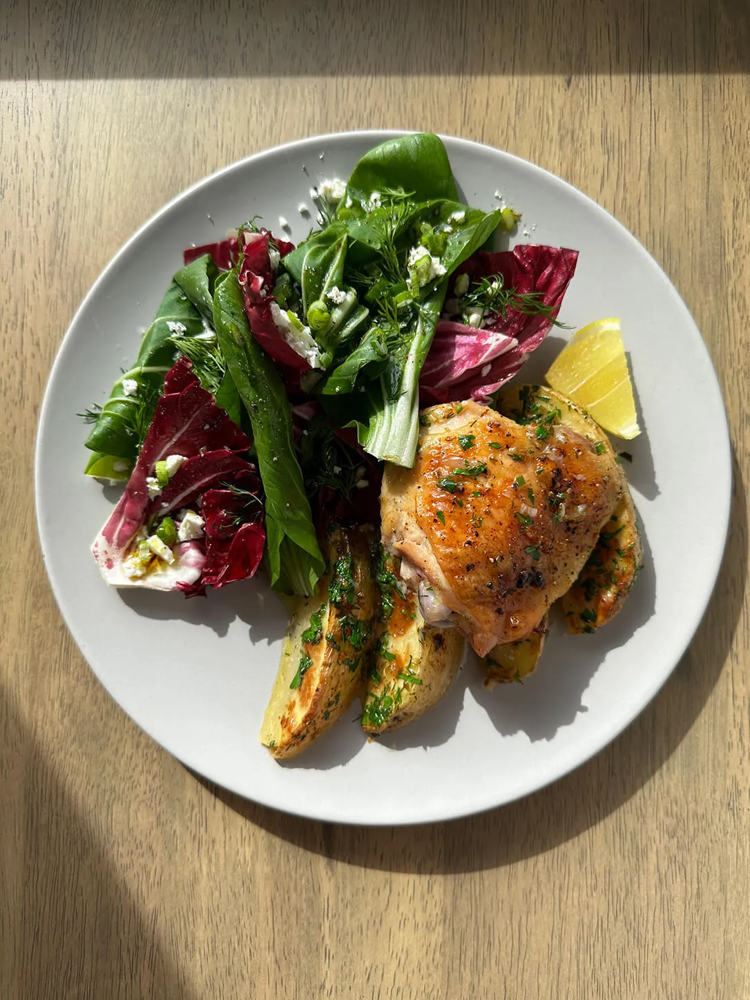 Herb-Infused Chicken Thighs with Roasted Potatoes