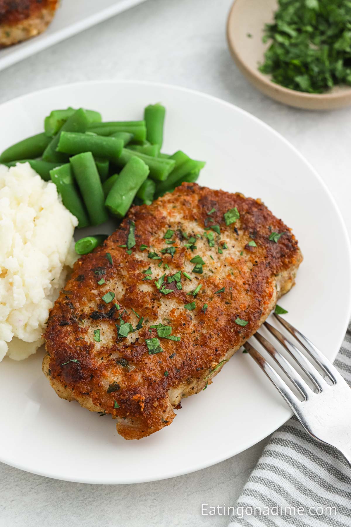 Savory Parmesan Crusted Pork Chops with Sautéed Green Beans