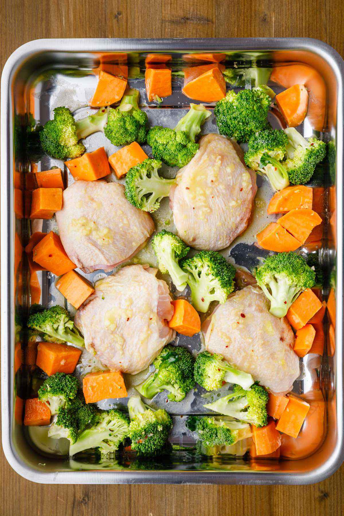 Herb-Roasted Chicken Thighs with Sweet Potato and Broccoli