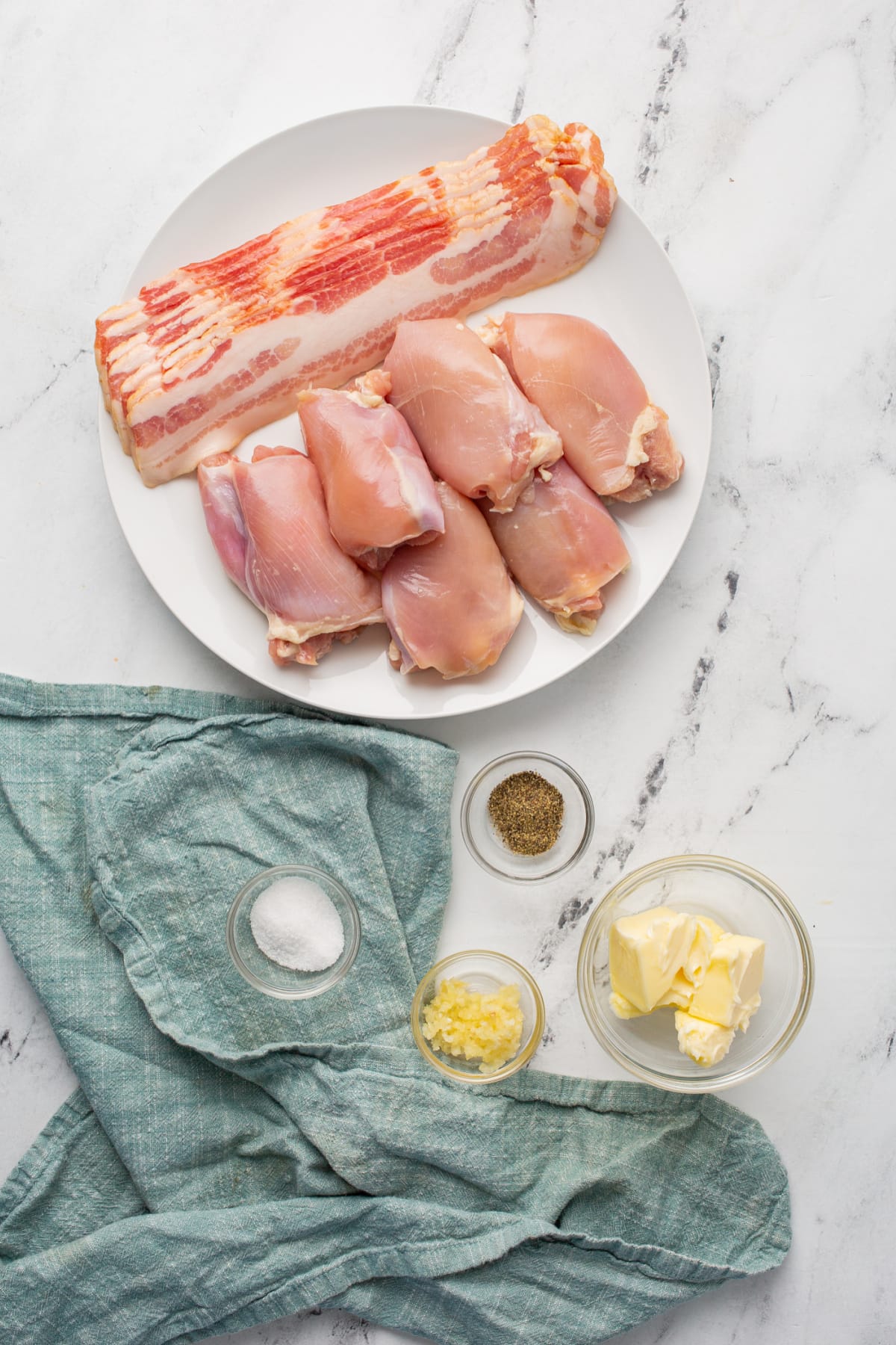 Bacon-Wrapped Chicken Thighs with Garlic Herb Butter