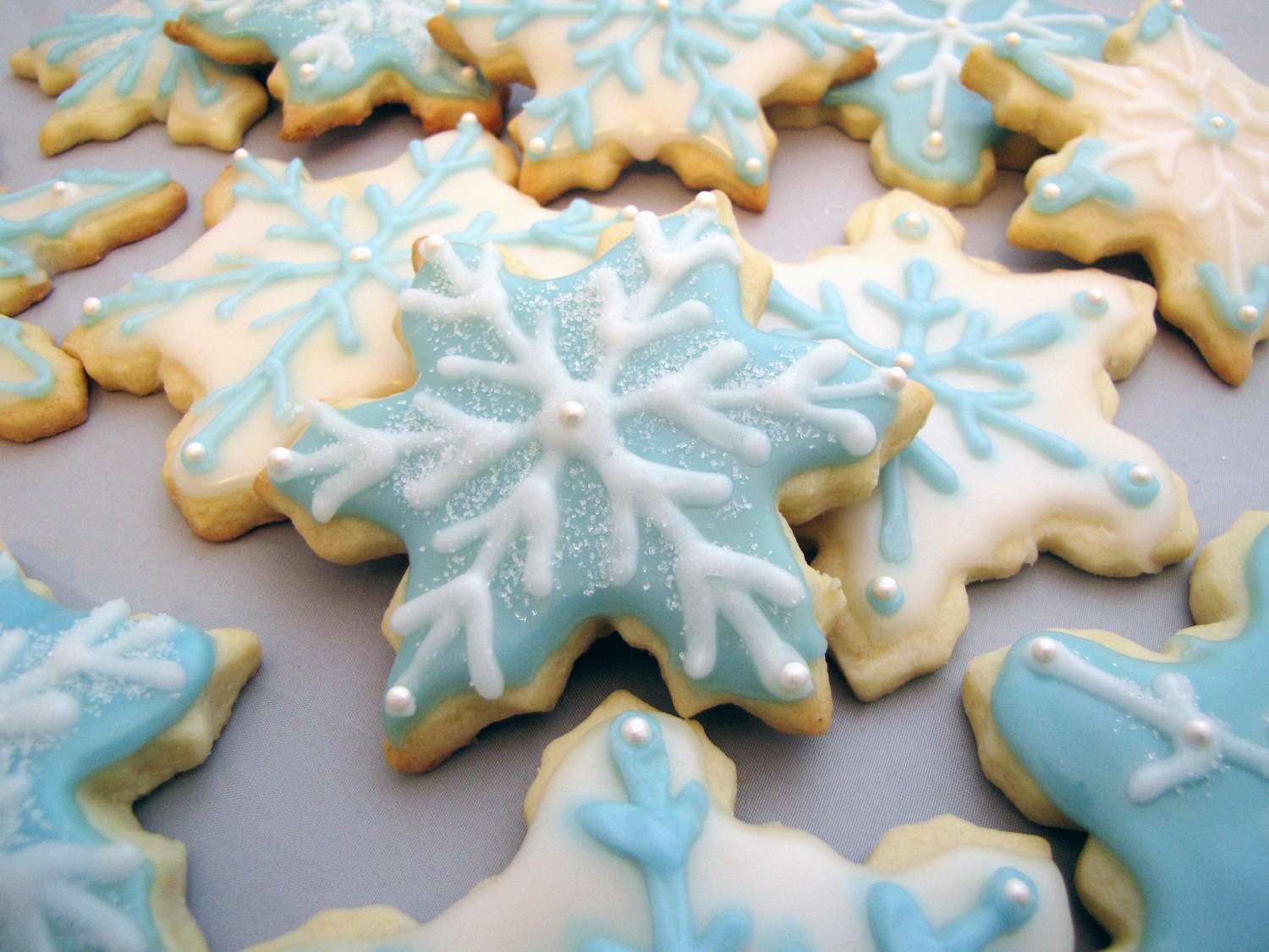 Snowflake-Shaped Sugar Cookies with Blueberry Icing