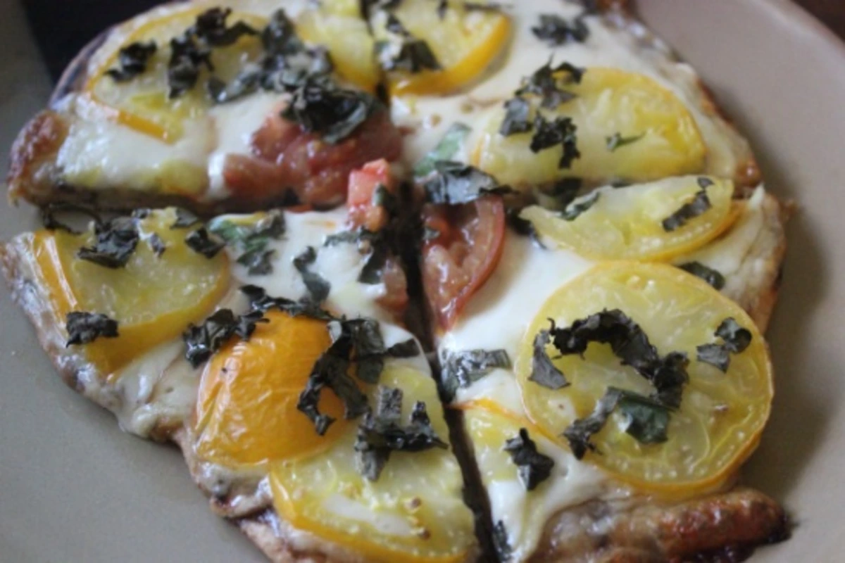 Hearty Tomato and Mozzarella Pizza with Fresh Basil