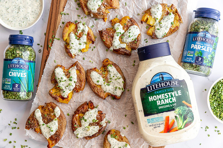 Baked Smashed Potatoes with Chipotle Crema and Pickled Onions