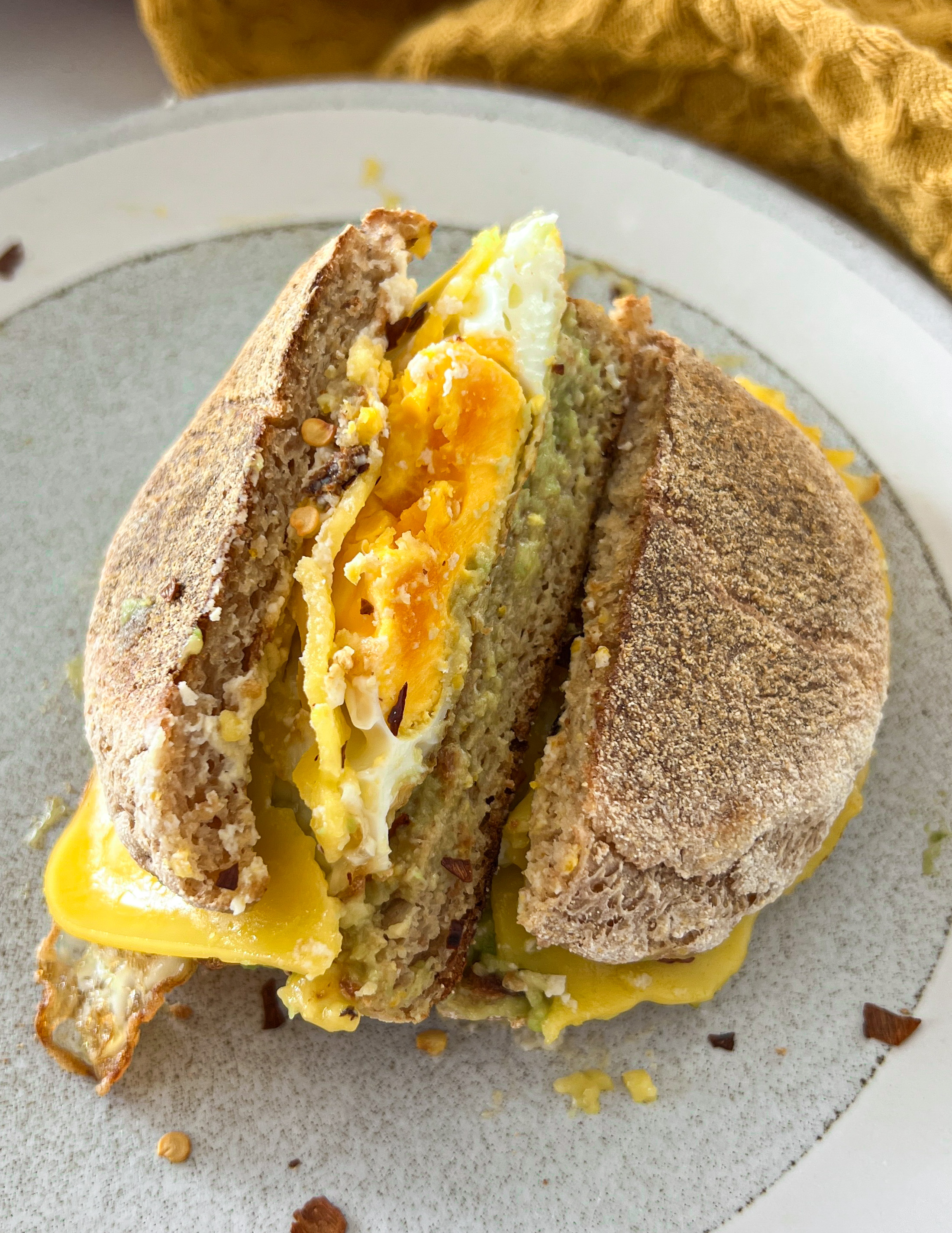 Fried Egg and Avocado Breakfast Sandwich on English Muffin