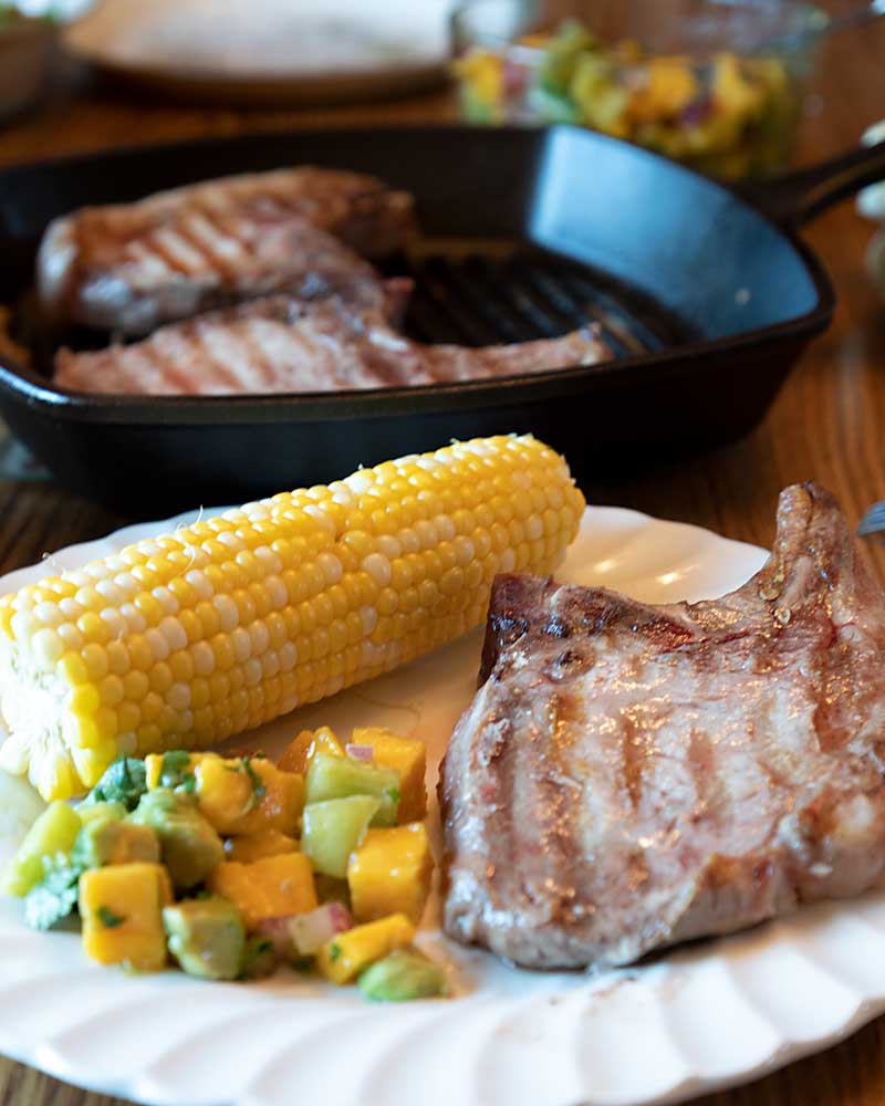 Pan-Seared Pork Chops with Caramelized Onions and Mango Salsa