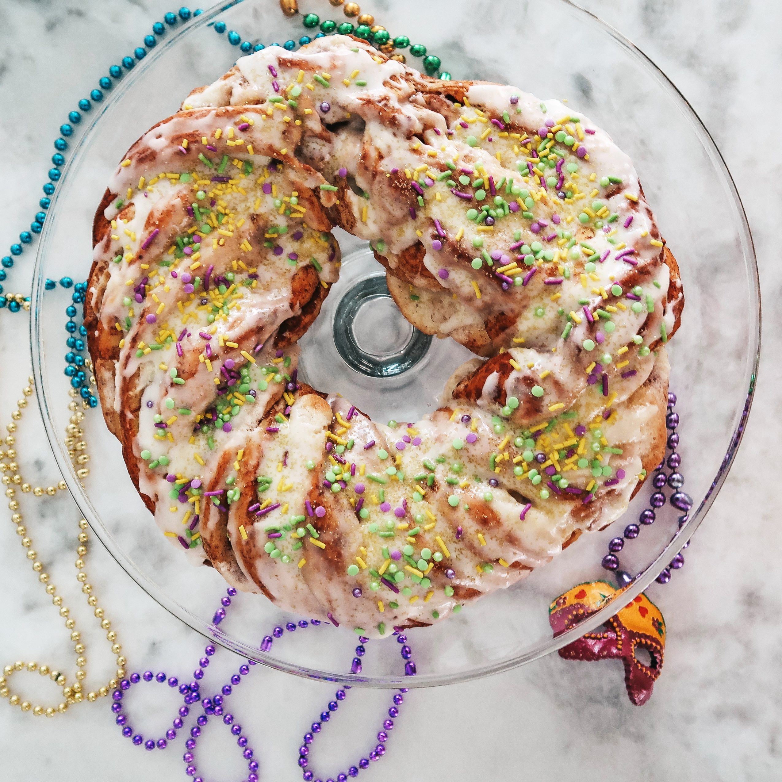 Classic King Cake with Cinnamon and Cream Cheese Filling