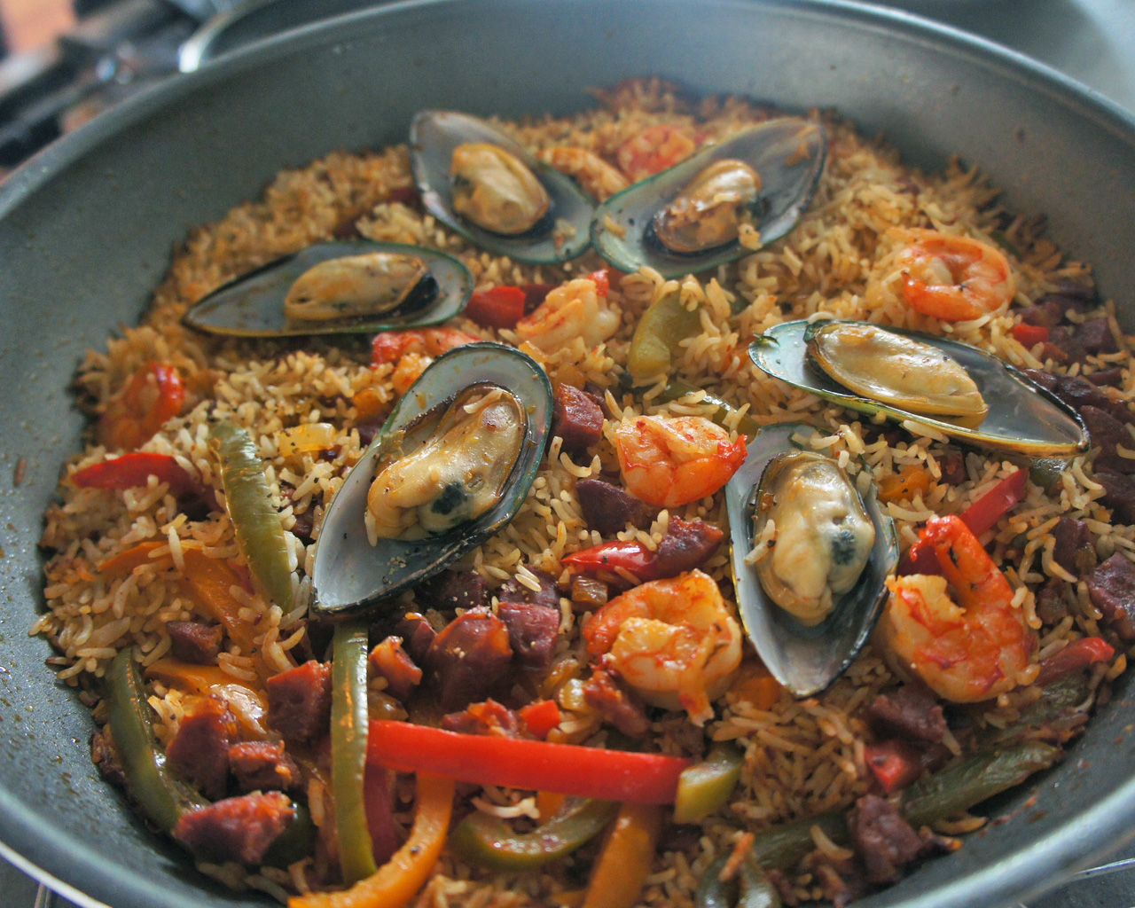 Saffron-Infused Seafood Paella with Chorizo and Peas