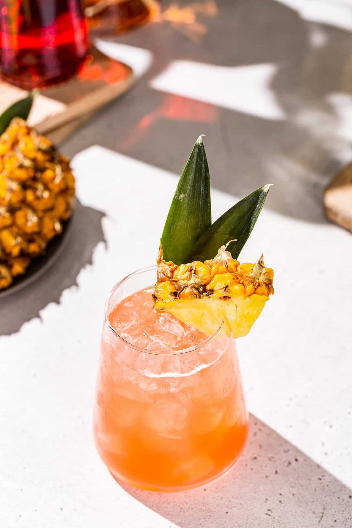 Stirred Dark Rum Tiki Cocktail with Pineapple and Campari