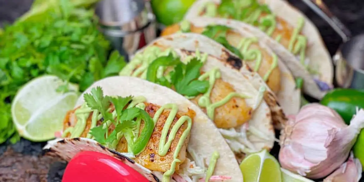 Pan-Seared Fish Tacos with Cabbage Slaw and Avocado Crema