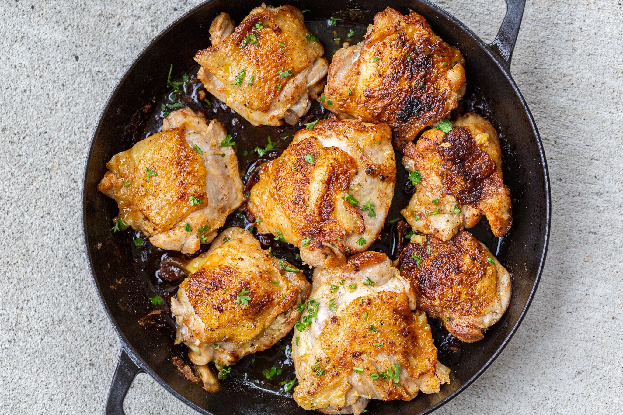 Pan-Seared Chicken Thighs with Garlic Spinach and Avocado Salsa