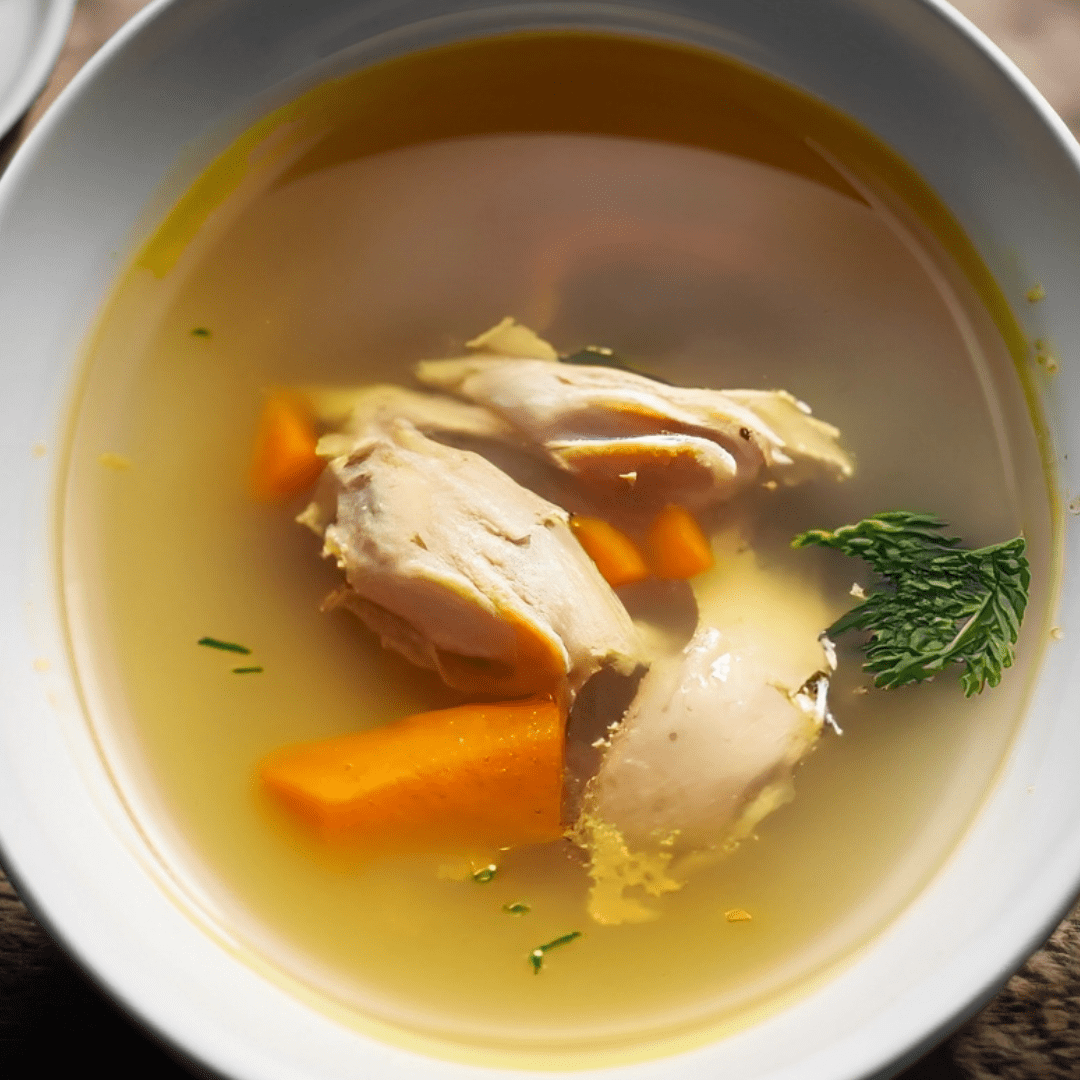 Clear Chicken and Vegetable Broth with Fresh Herbs