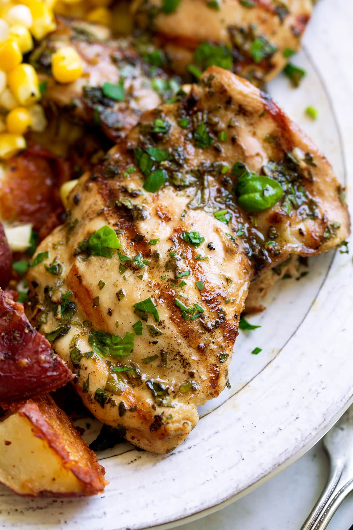Grilled Herb-Marinated Chicken with Roasted Garlic Potatoes