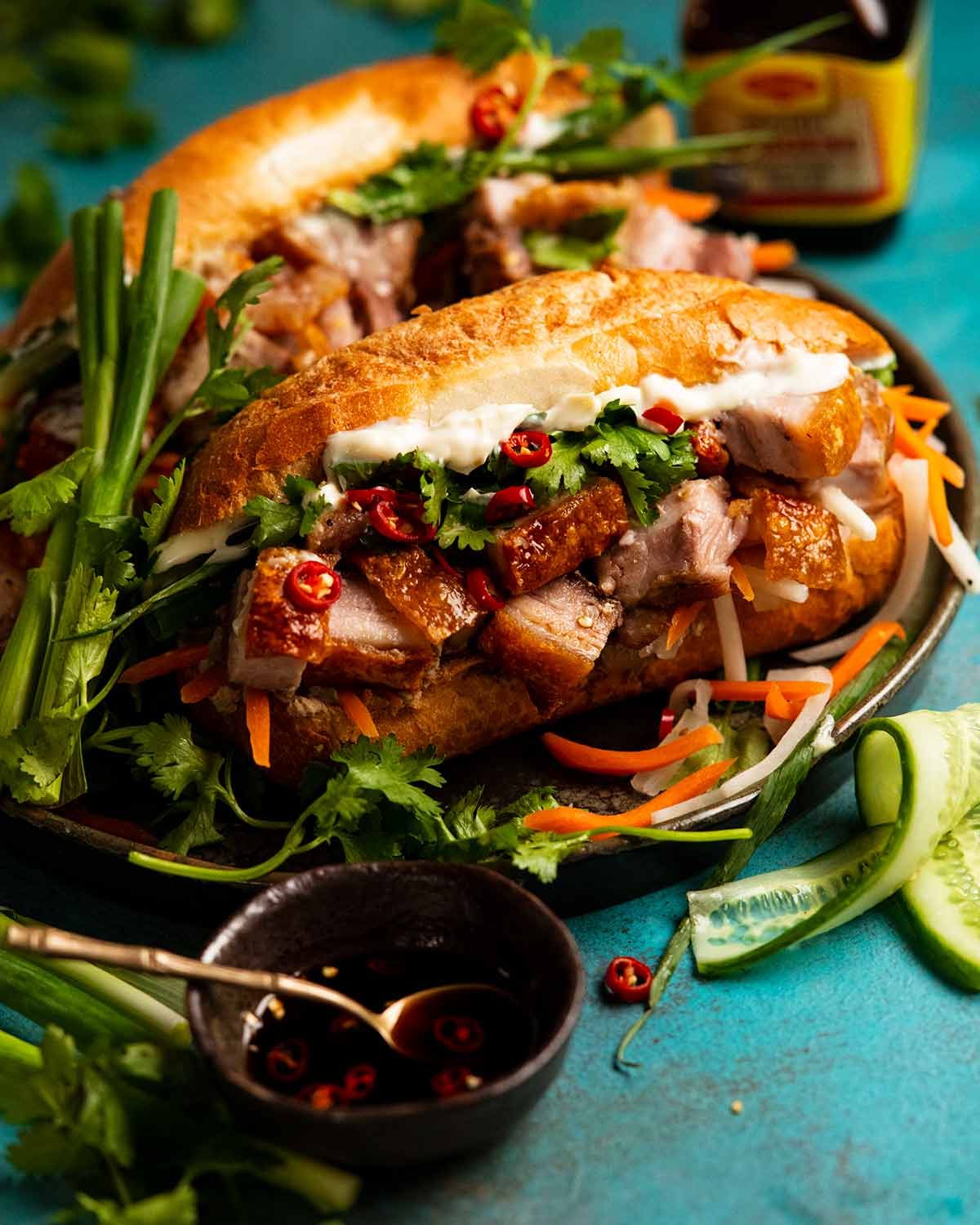 Pan-Fried Pork Belly Bánh Mì with Spicy Mayo and Fresh Herbs