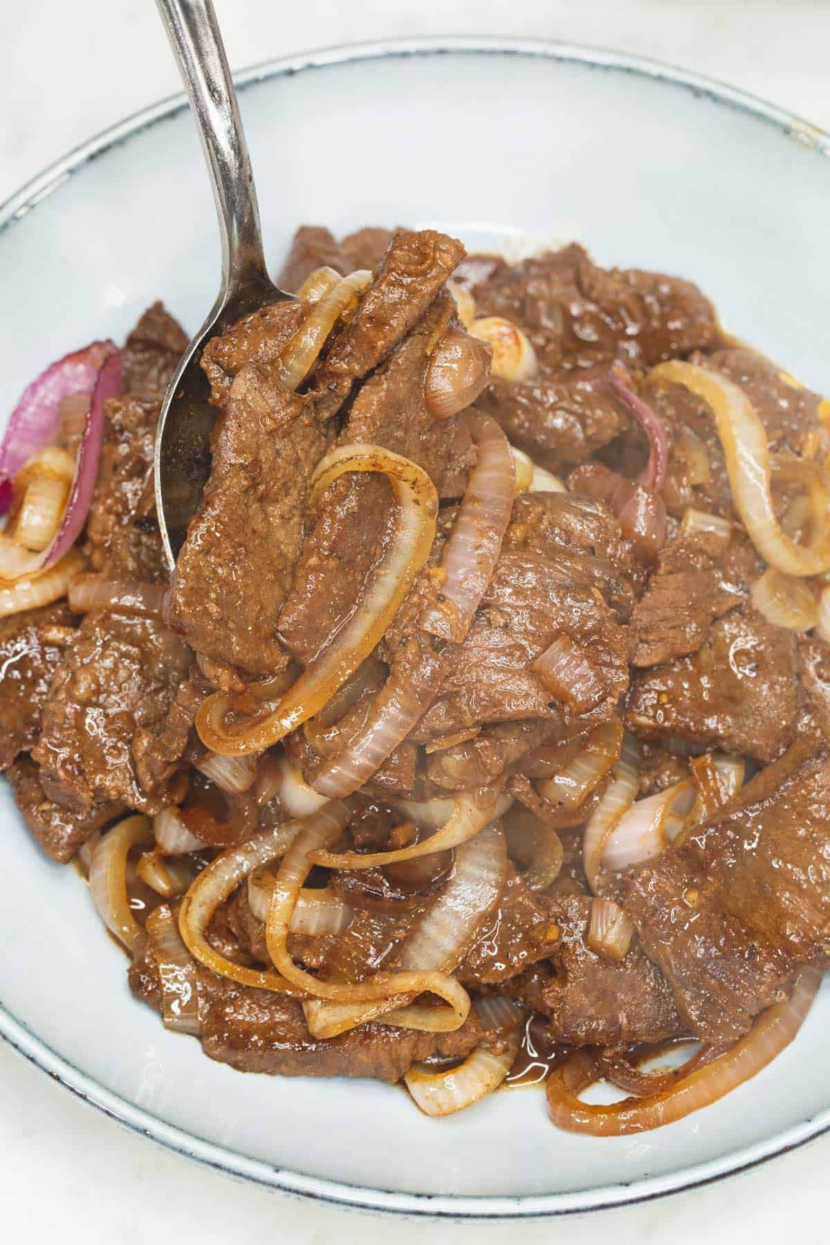Pan-Seared Beef Bistek with Calamansi and Caramelized Onions