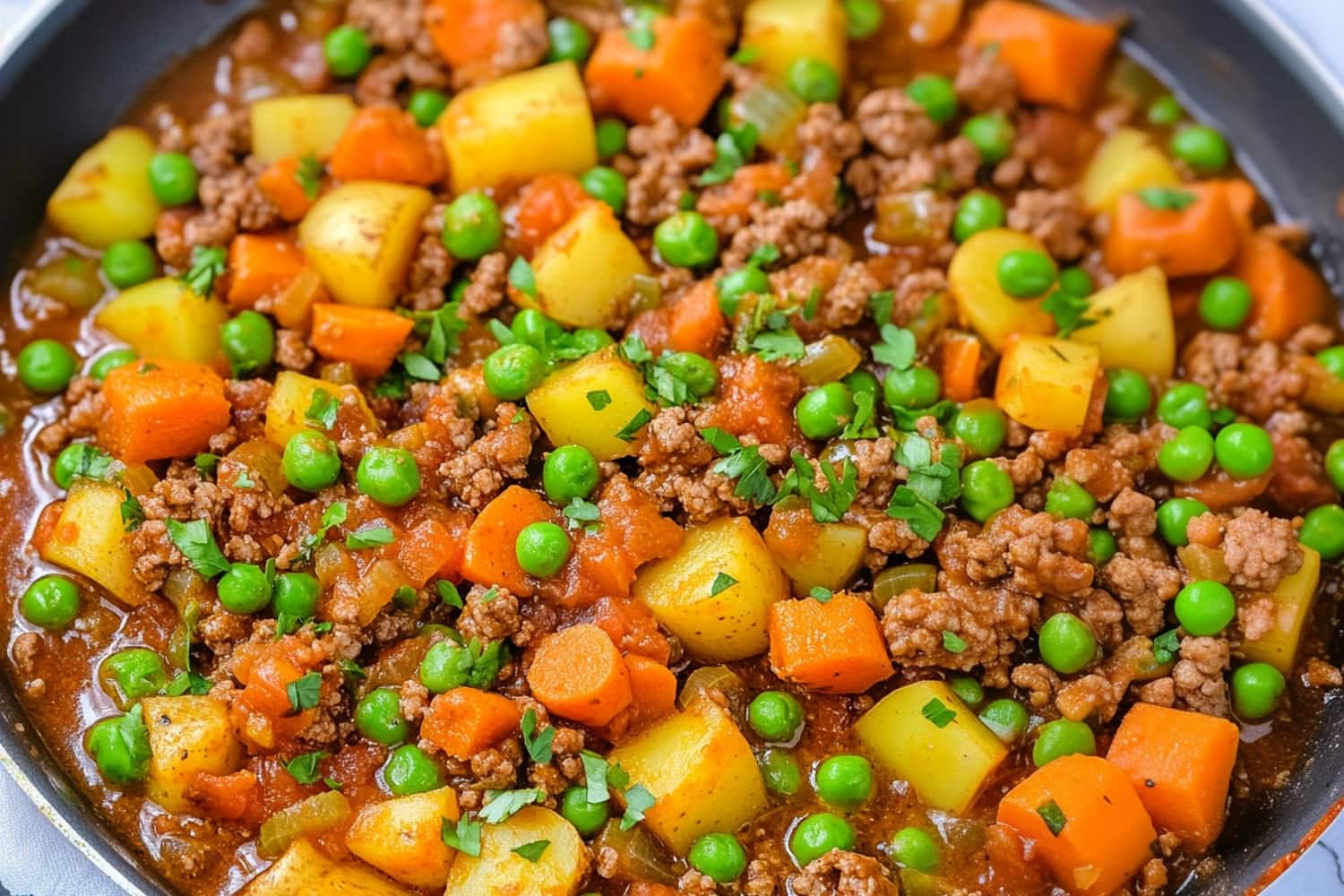 Ground Beef Picadillo with Potatoes and Green Peas