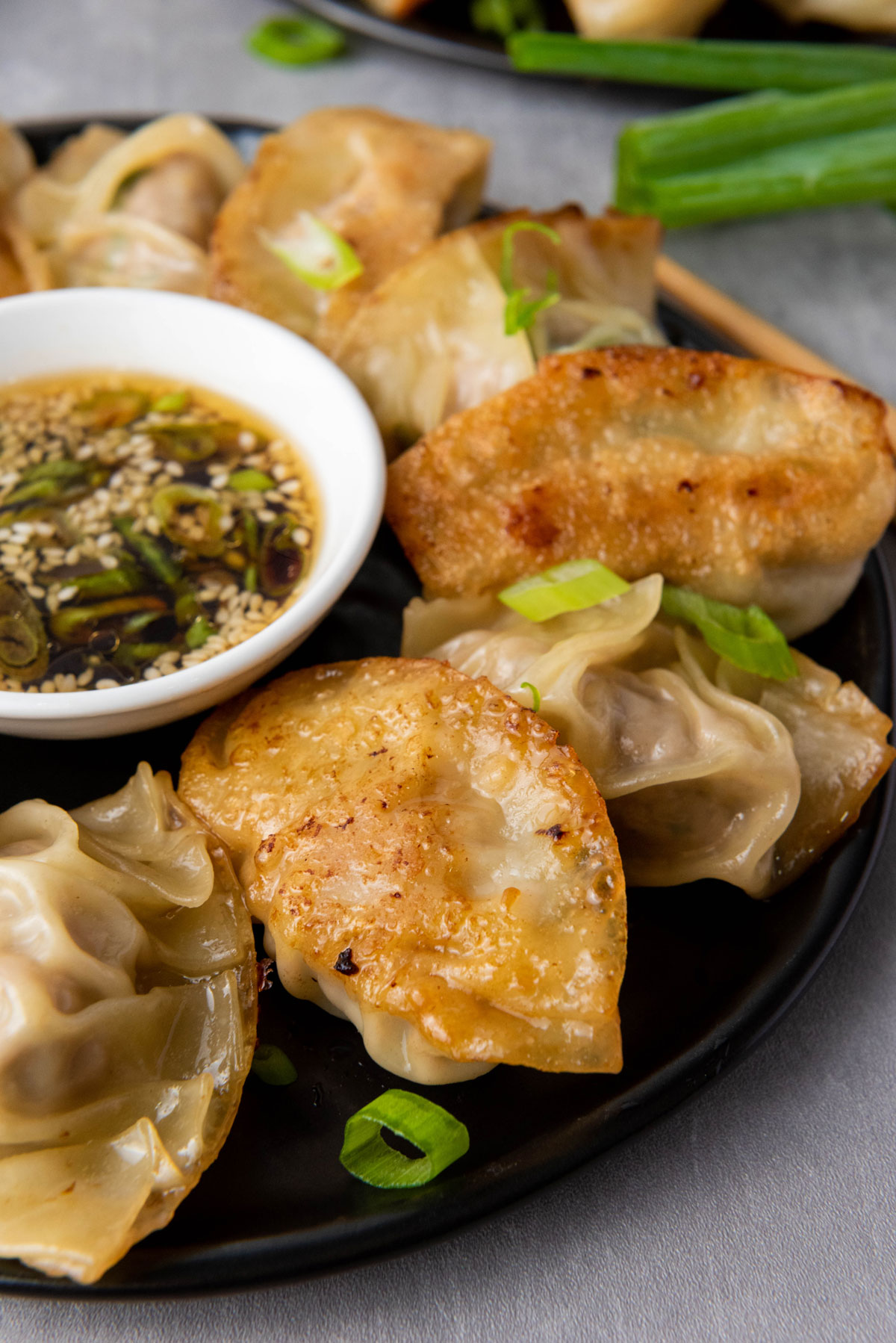 Pan-Seared Pork Dumplings with Ginger-Scallion Dipping Sauce