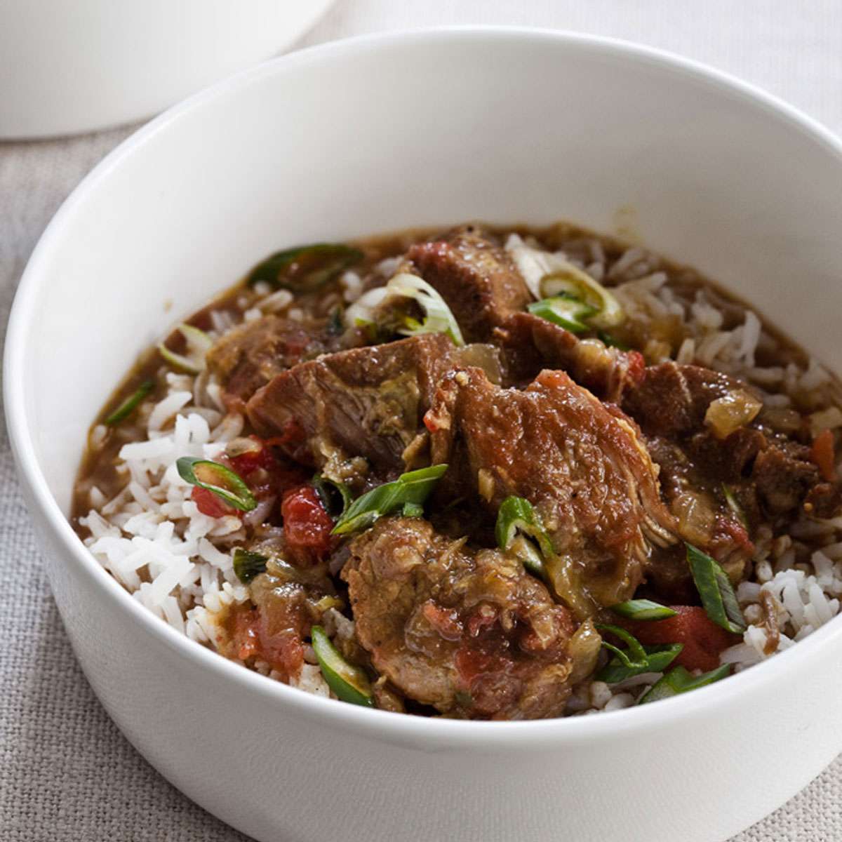 Coconut Curry Braised Pork Shoulder with Spinach and Tomatoes