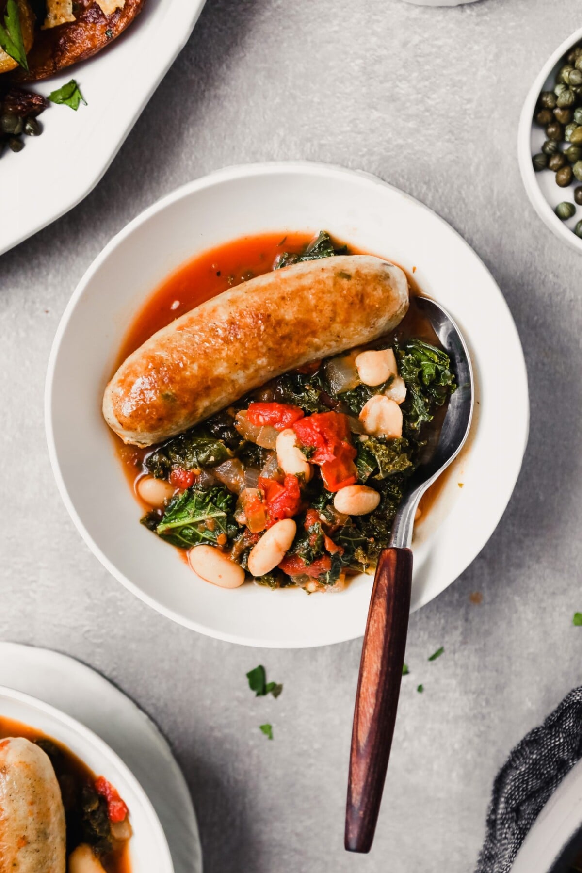 Pan-Seared Chicken with Sautéed Italian Sausage and White Beans