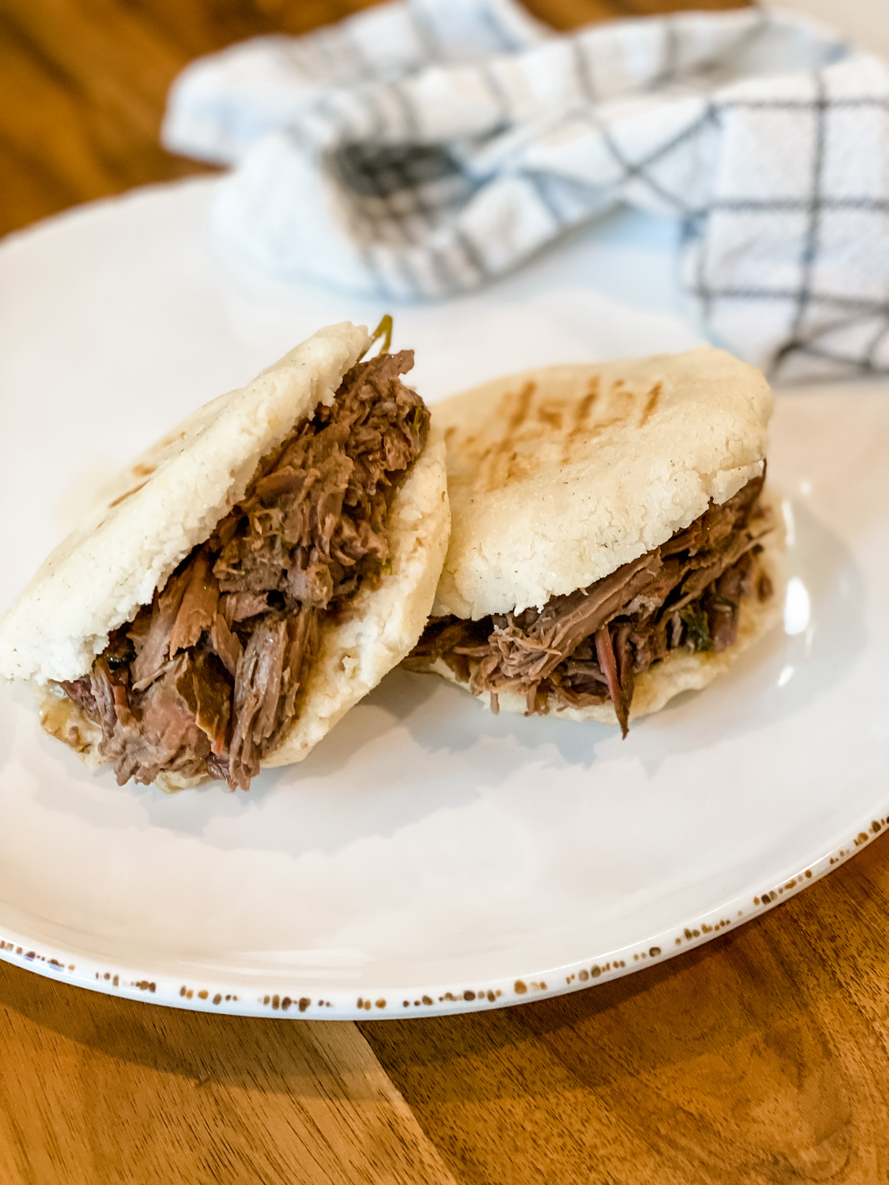 Cornmeal Arepas with Shredded Beef and Avocado Crema
