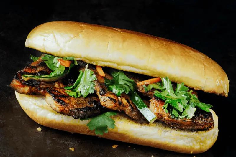 Slow-Roasted Five-Meat Bánh Mì with Pickled Vegetables and Fresh Herbs