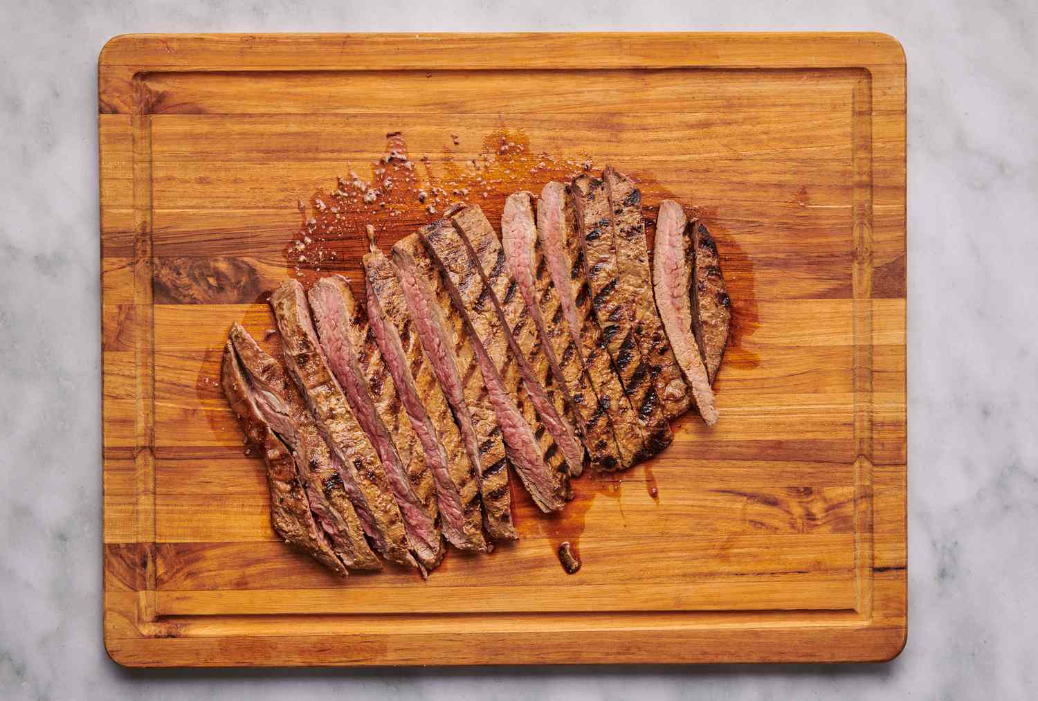 Charcoal-Grilled Beef Flank Steak with Garlic and Rosemary