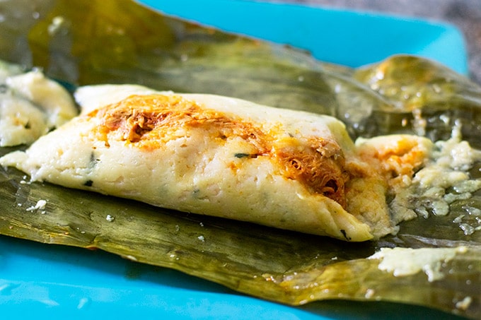 Steamed Corn and Pork Tamales Wrapped in Banana Leaves