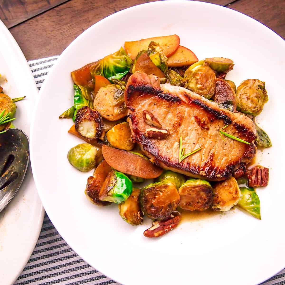 Pan-Seared Pork Chops with Apple Cider Reduction and Sautéed Brussels Sprouts