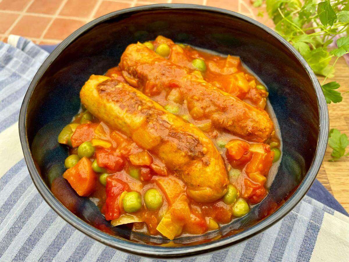 Slow-Braised Australian Curried Sausages in Tomato Sauce