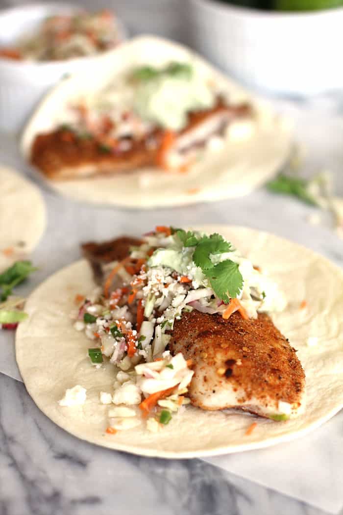 Baked Mexican-Spiced Fish Tacos with Avocado Crema