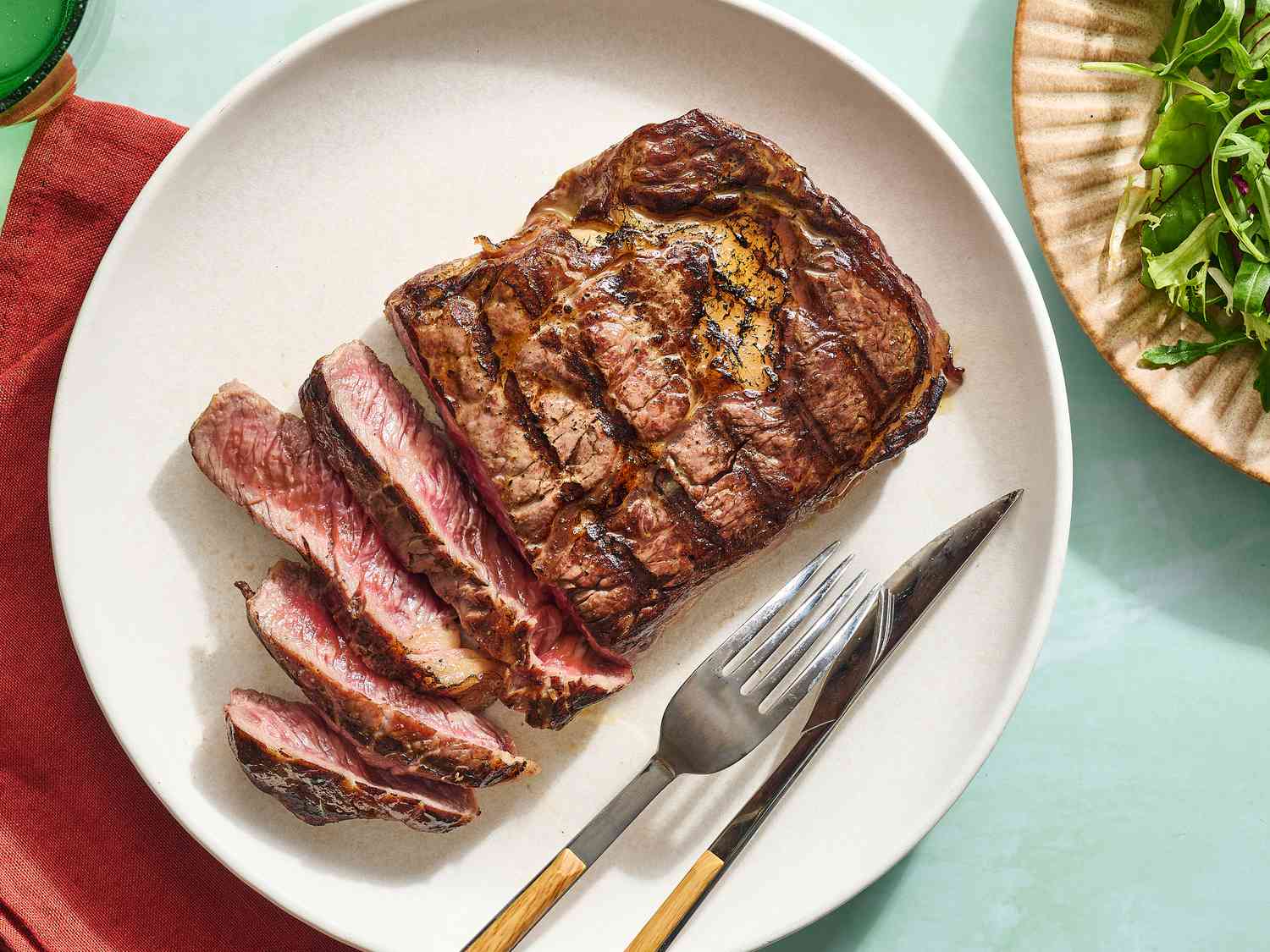 Charcoal-Grilled Ribeye Steak with Garlic Butter