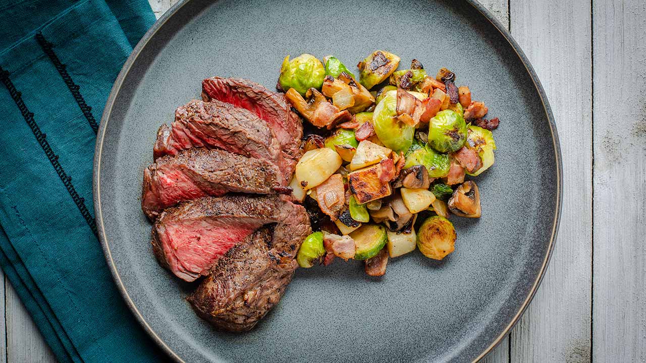 Pan-Seared Beef Sirloin with Roasted Brussels Sprouts and Carrots