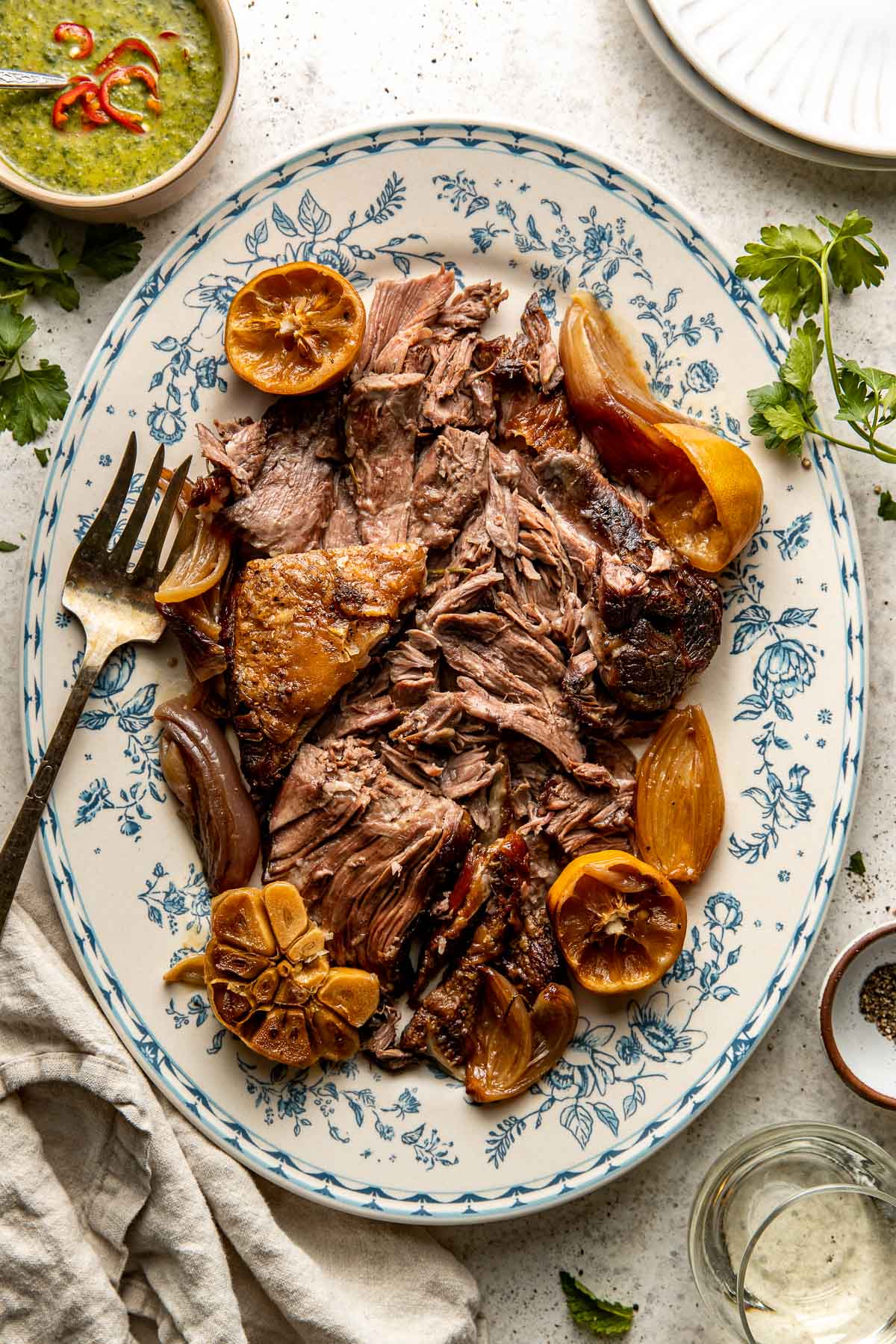 Slow-Roasted Mediterranean Lamb Shoulder with Herb Garlic Sauce