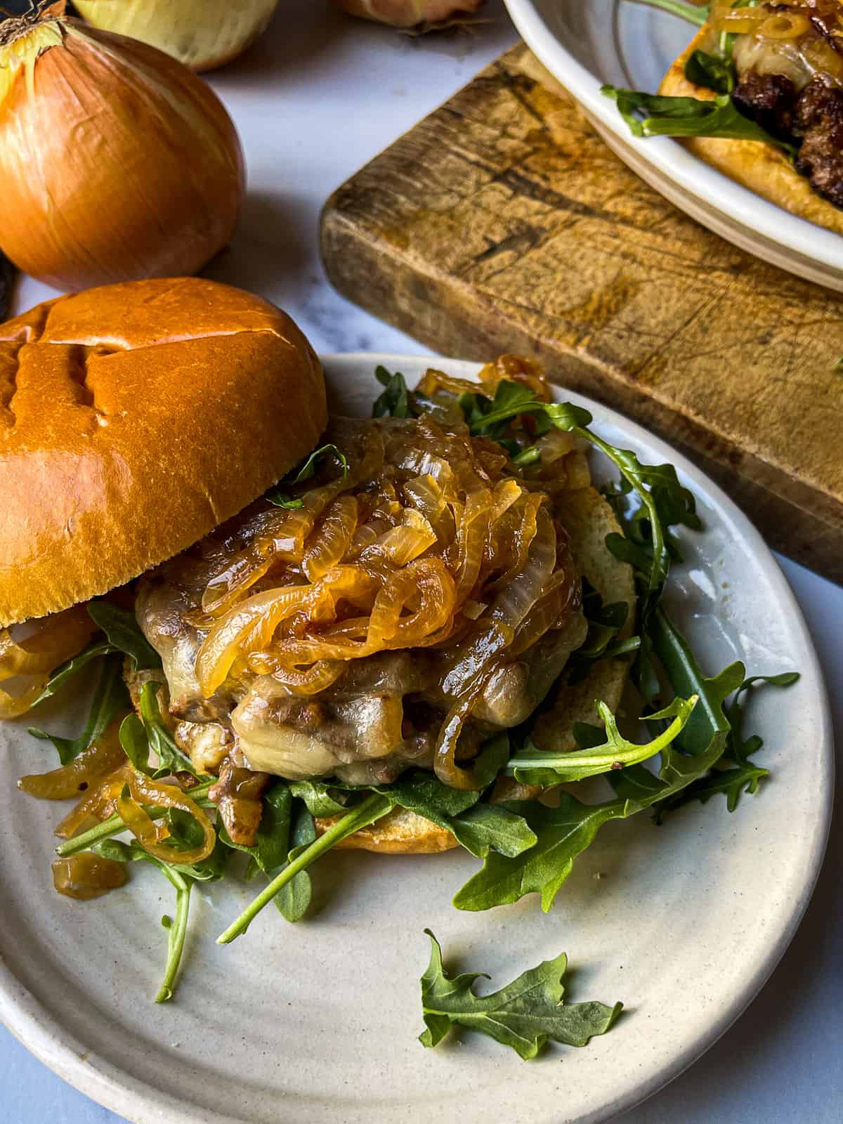 Pan-Seared Burger with Arugula and Pickled Red Onion