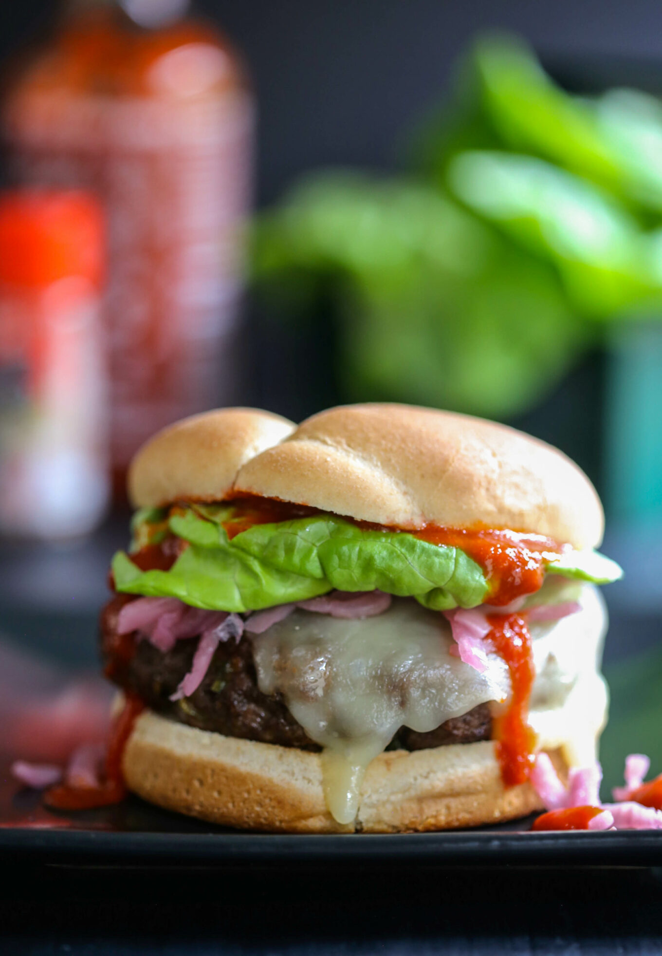 Pan-Seared Burger with Mixed Greens and Pickled Red Onion