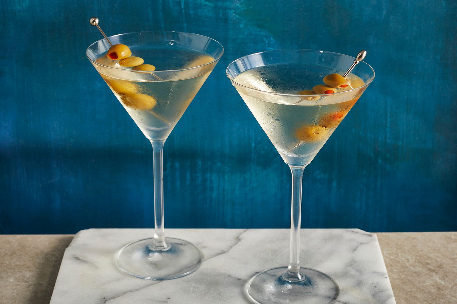 Vodka Martini Shaken with Green Olive Garnish