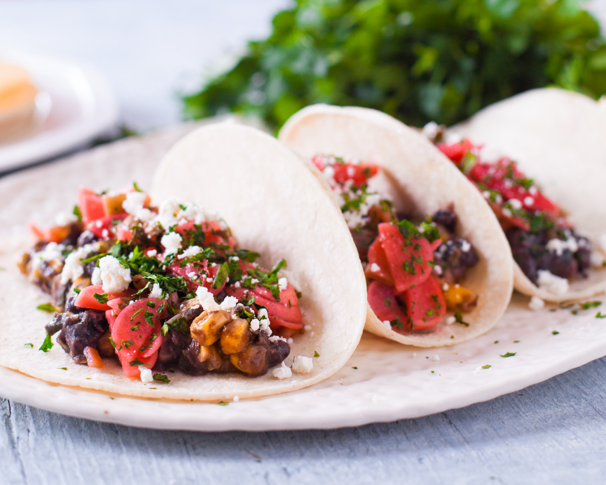 Mexican-Style Black Bean and Corn Tacos with Avocado Crema