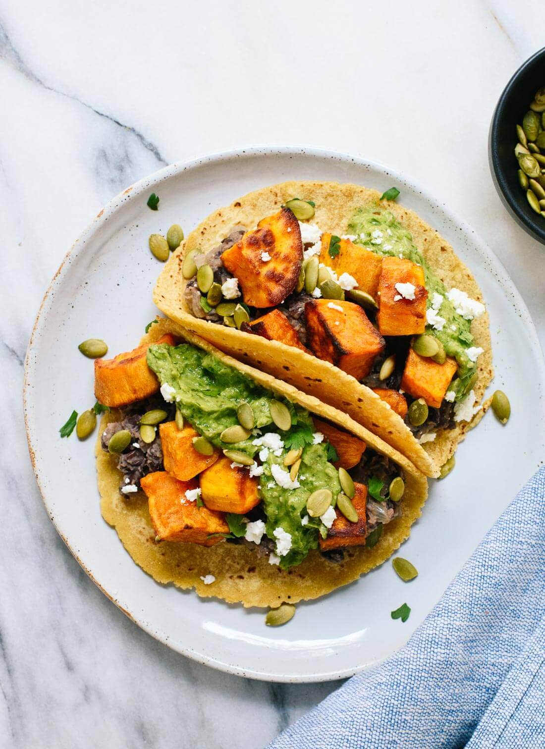 Taco-Stuffed Sweet Potatoes with Black Beans and Avocado Crema