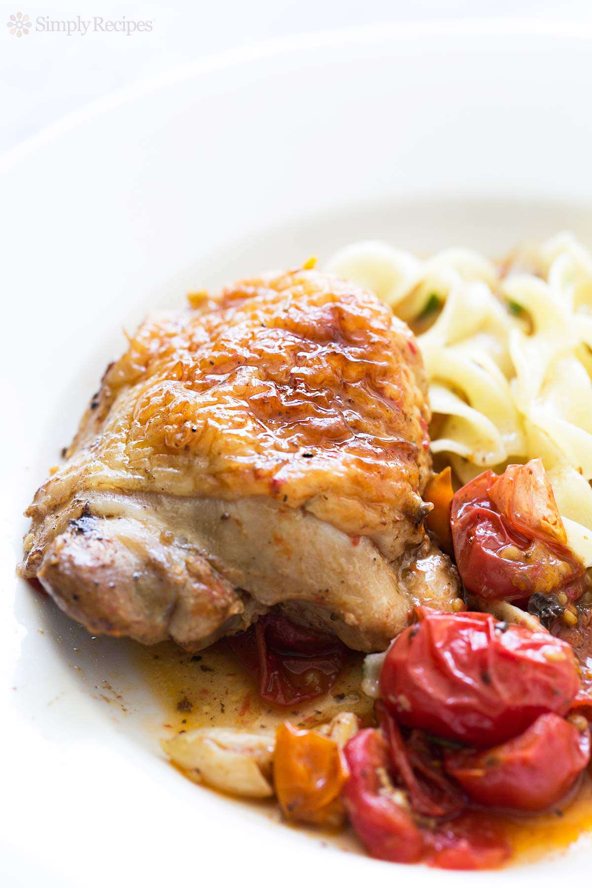 Sautéed Garlic Butter Chicken Thighs with Spinach and Cherry Tomatoes