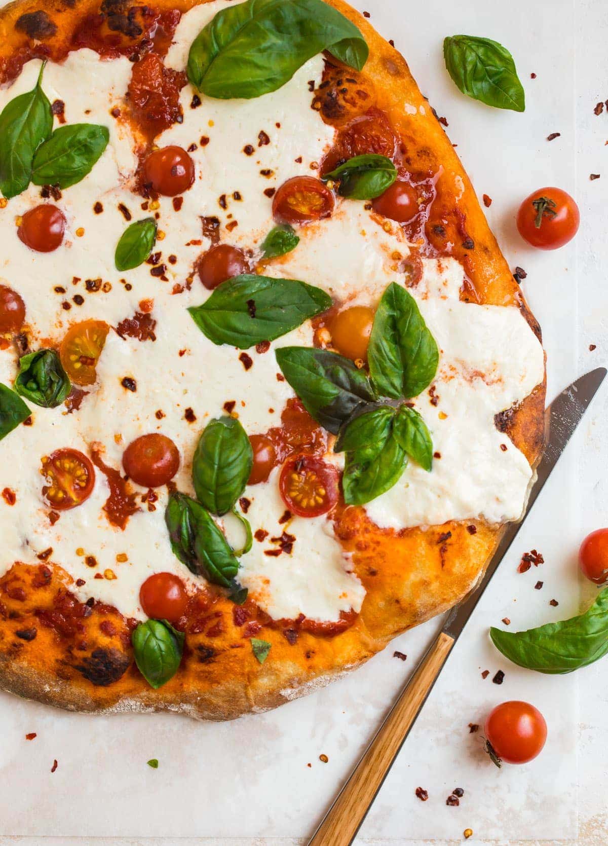 Wood-Fired Pizza with Burrata, Roasted Cherry Tomatoes, and Basil