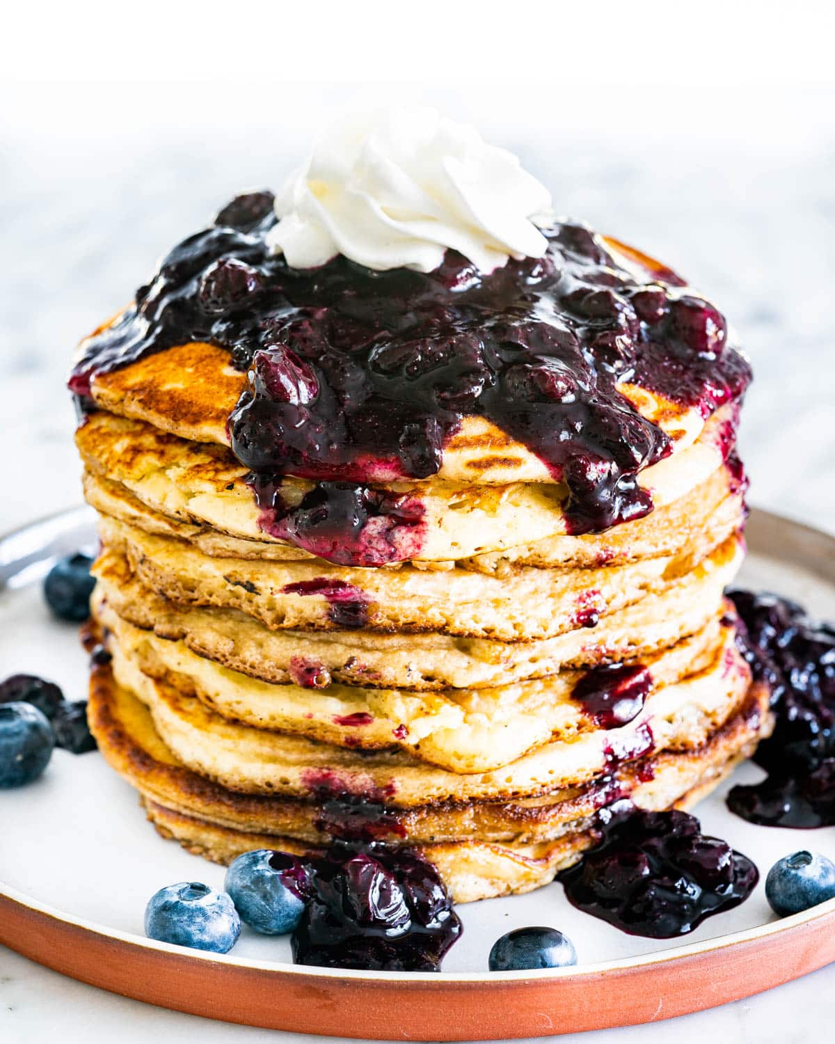 Snow-Covered Vanilla Bean Pancakes with Frosted Blueberry Sauce