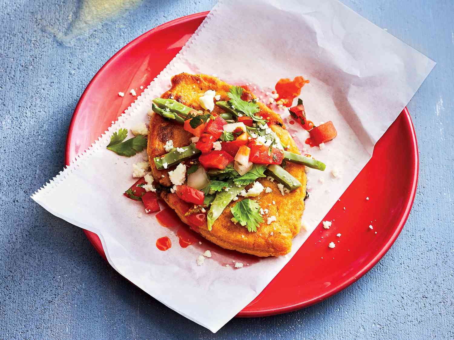 Pan-Fried Tlacoyos Filled with Refried Pinto Beans and Queso Oaxaca