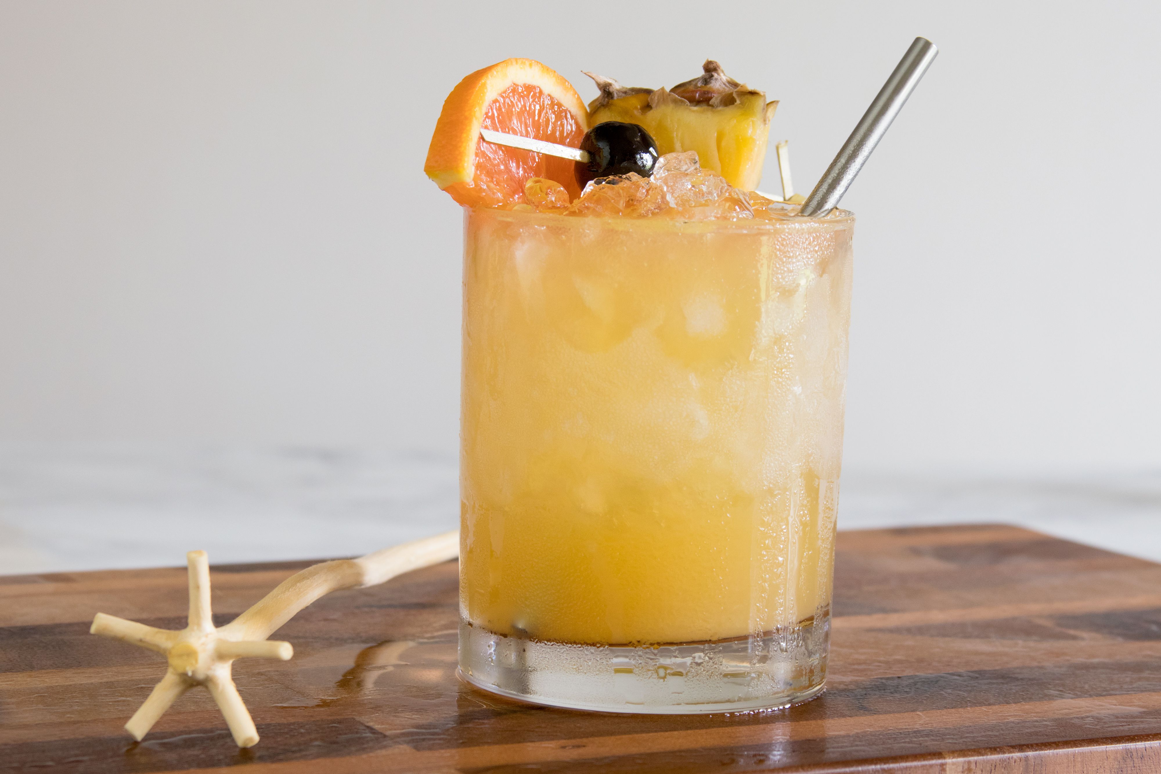 Muddled Pineapple Rum Cooler with Lime and Mint